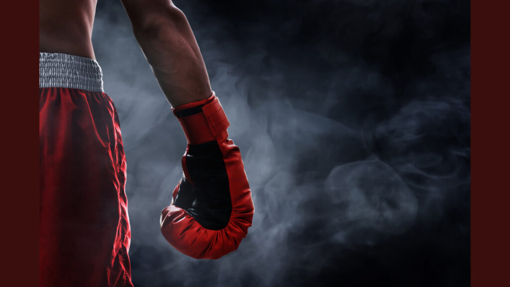 the boxer - closeup of lower body and one glove of a boxer