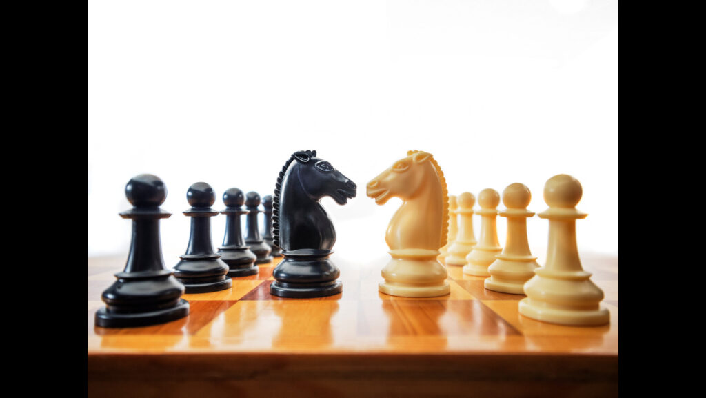 Black and white knights alone on an unlikely chessboard